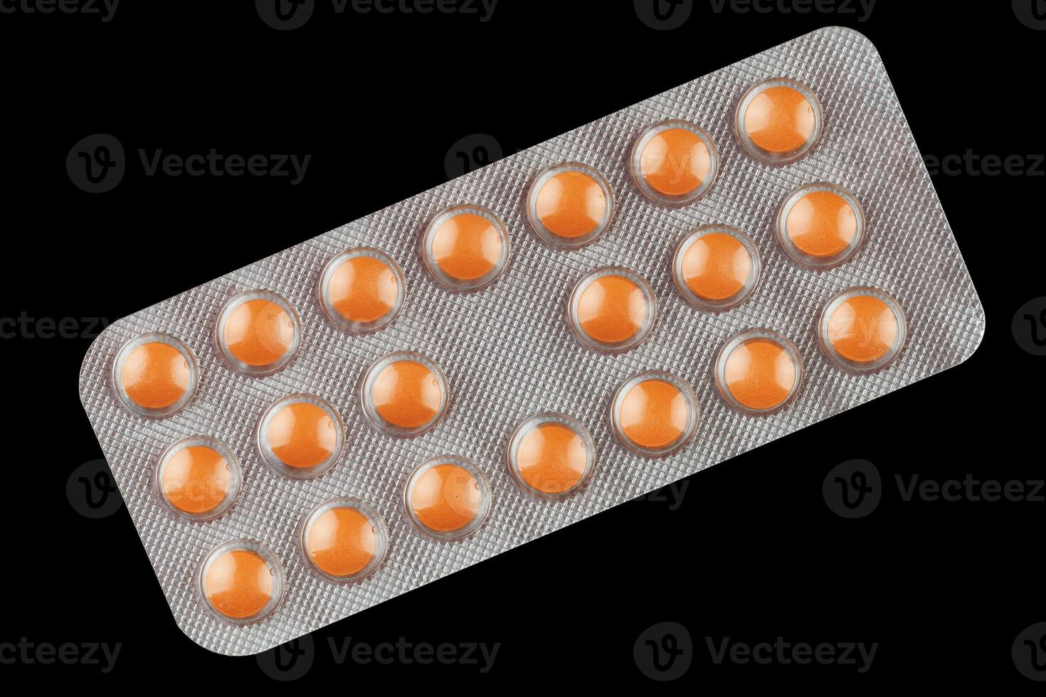 naranja pastillas en un transparente ampolla foto