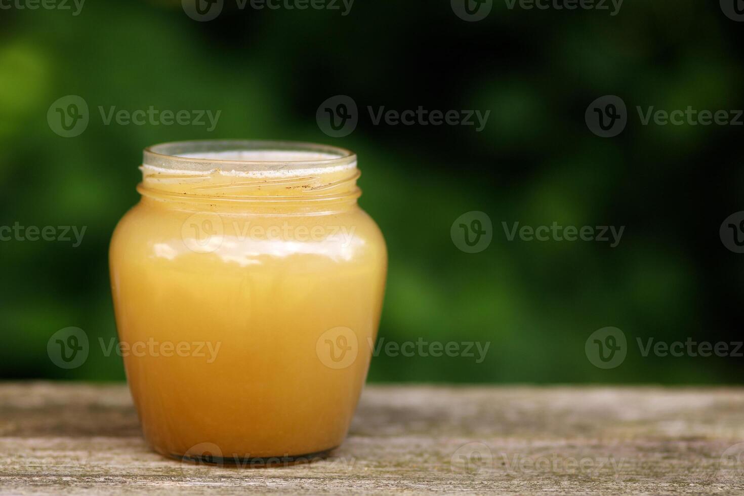 Honey in a jar place for text cope space photo