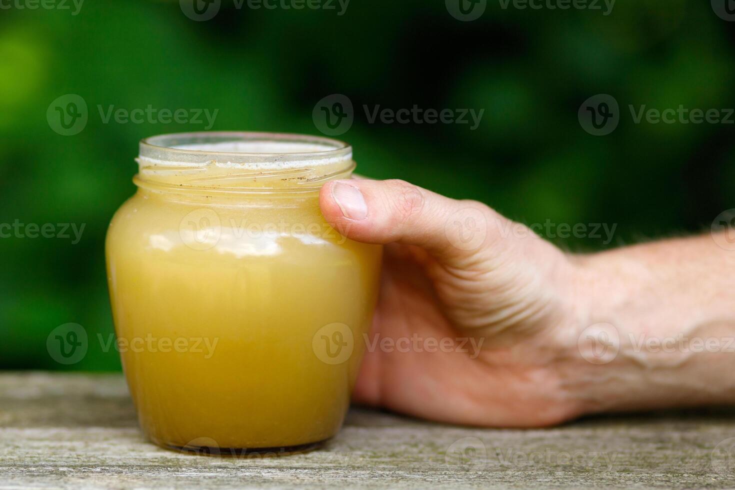 Honey in a jar on the pass. photo