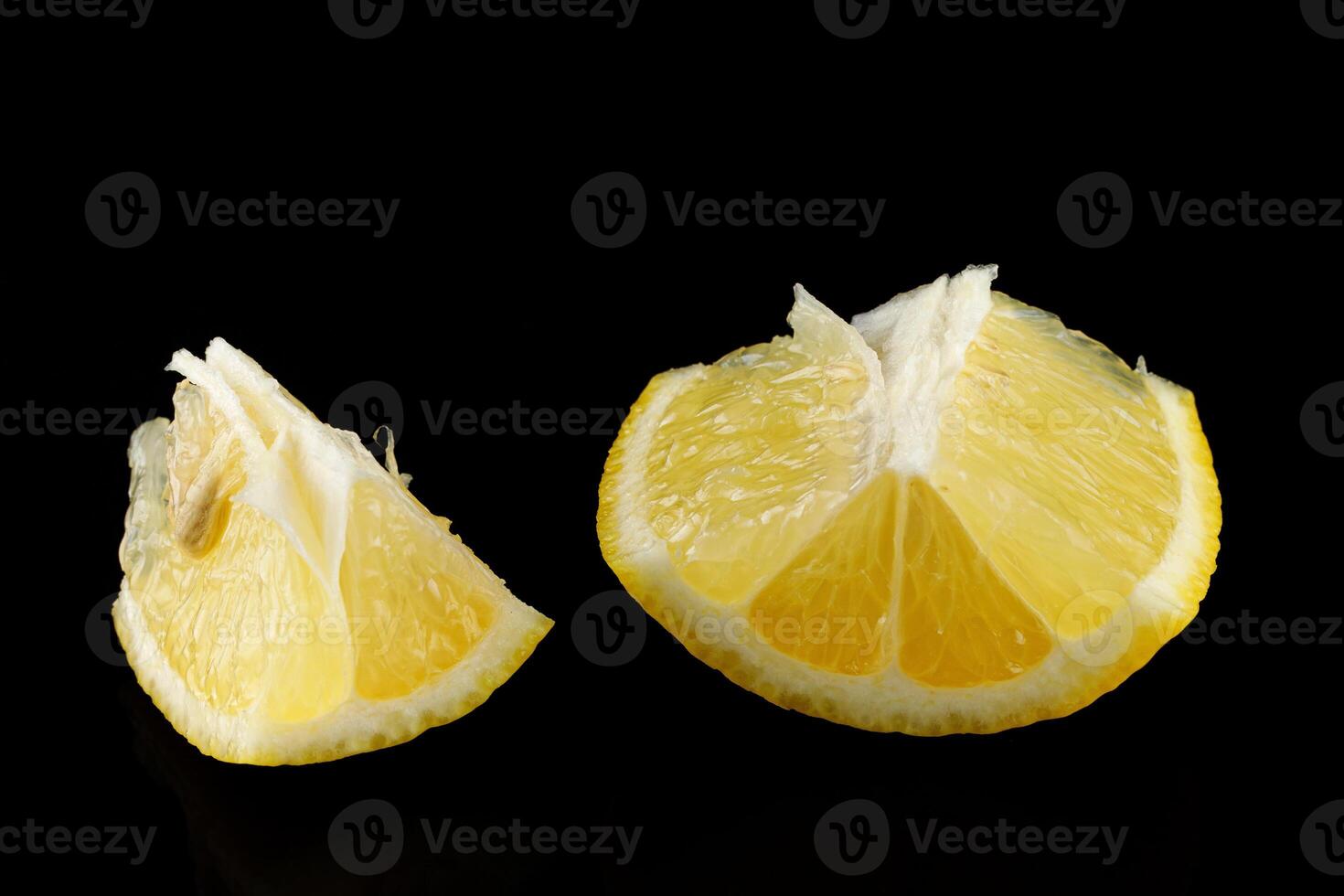 Piece of lemon isolate on black photo