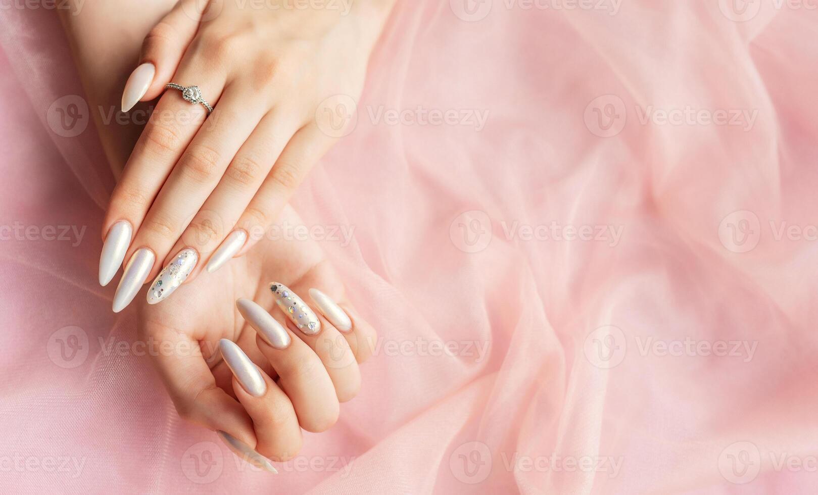 Female Hands with beautiful pearl manicure photo