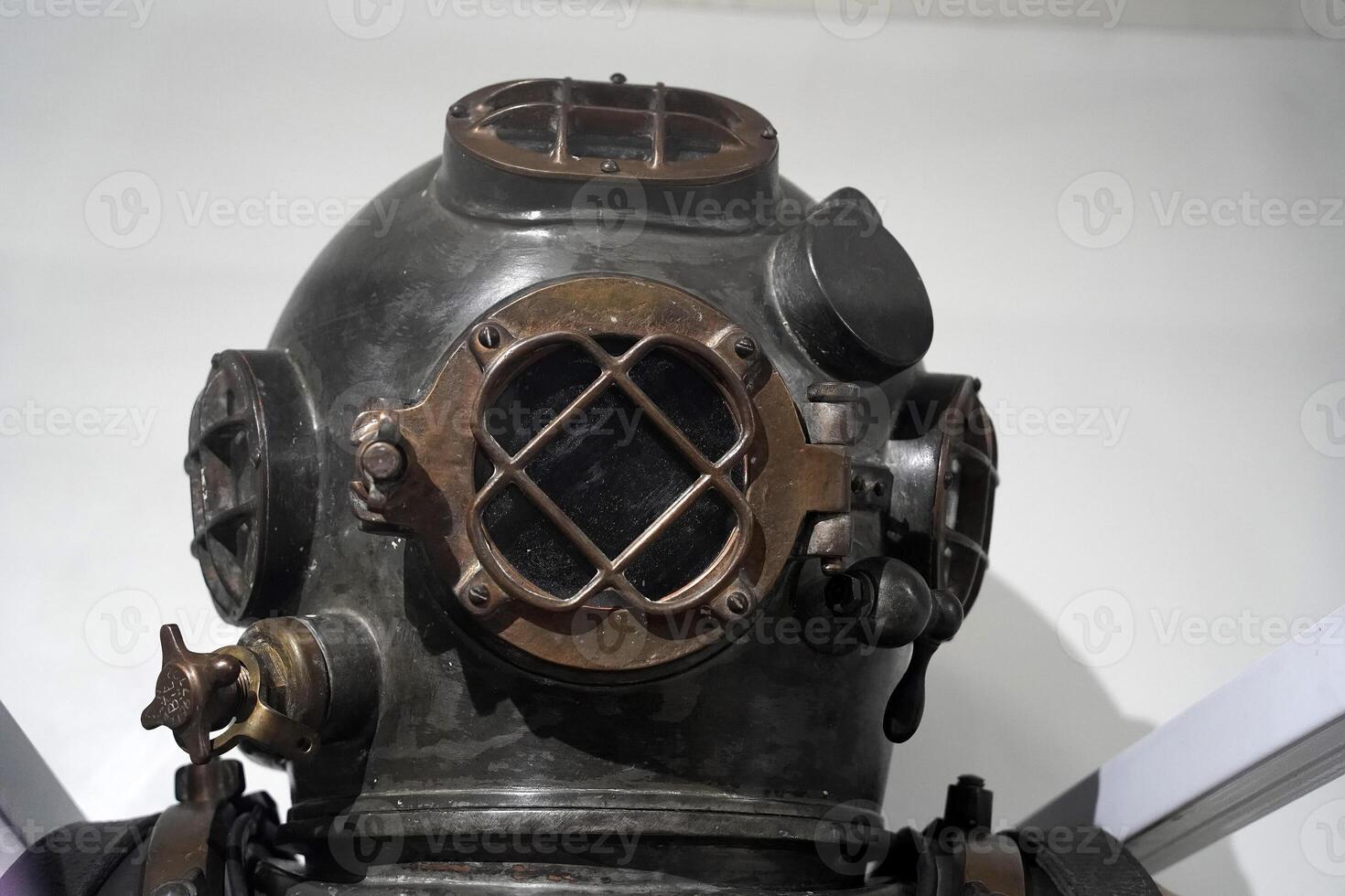 Old antique copper scuba helmet photo
