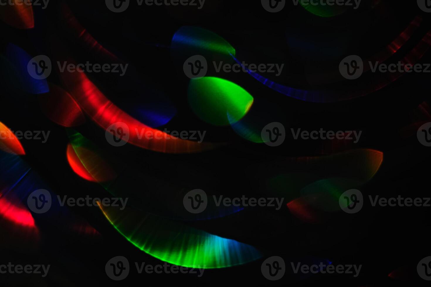 Abstract black background with bokeh of different colors. photo