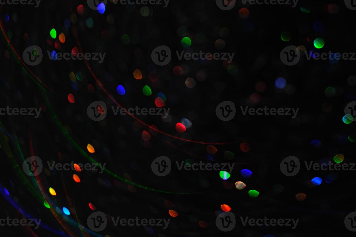 Abstract black background with bokeh of different colors. photo