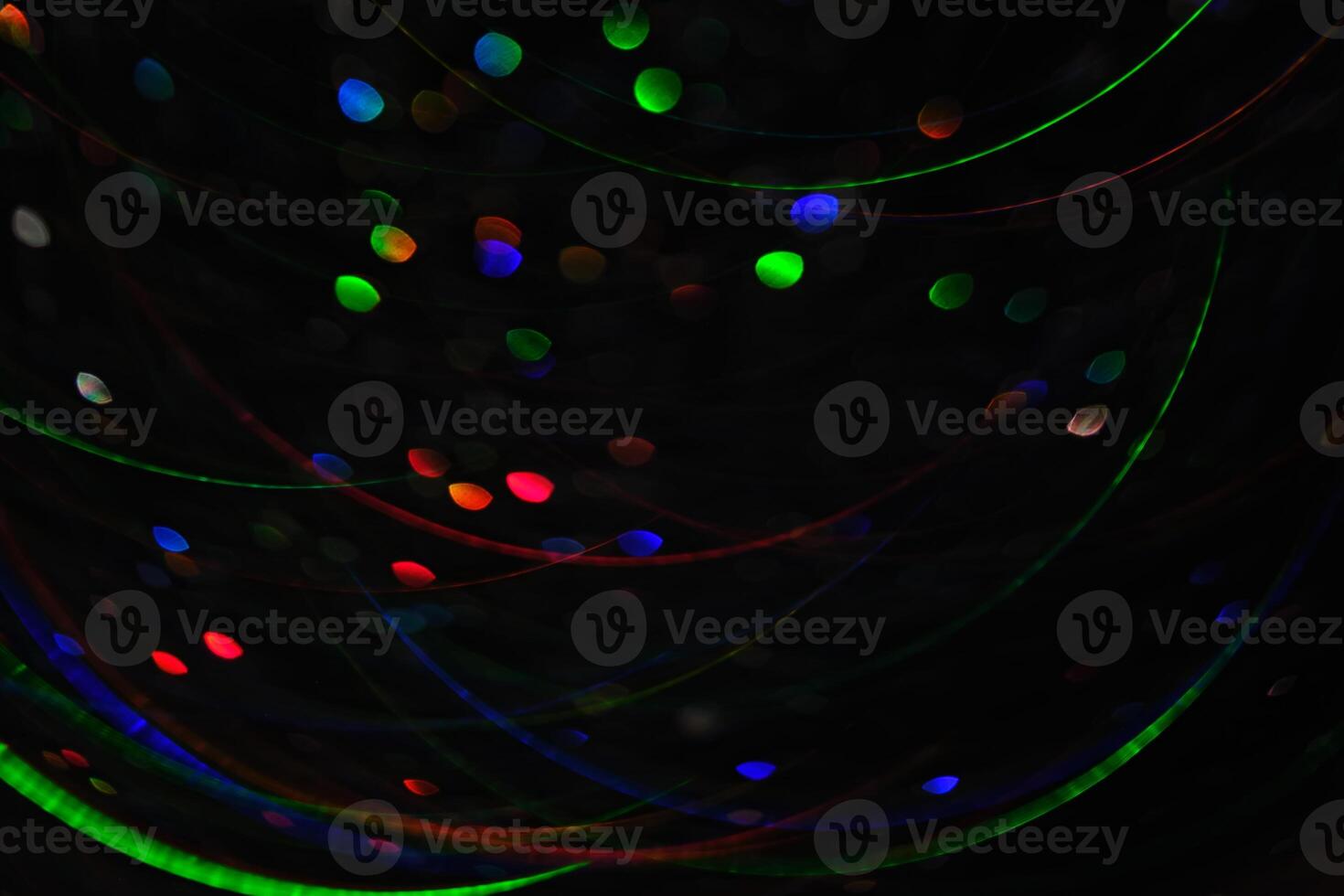 Abstract black background with bokeh of different colors. photo