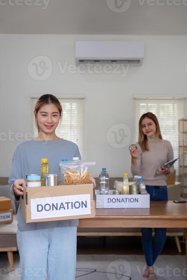 Volunteer Organizing Donation for Charity at a Community Center photo