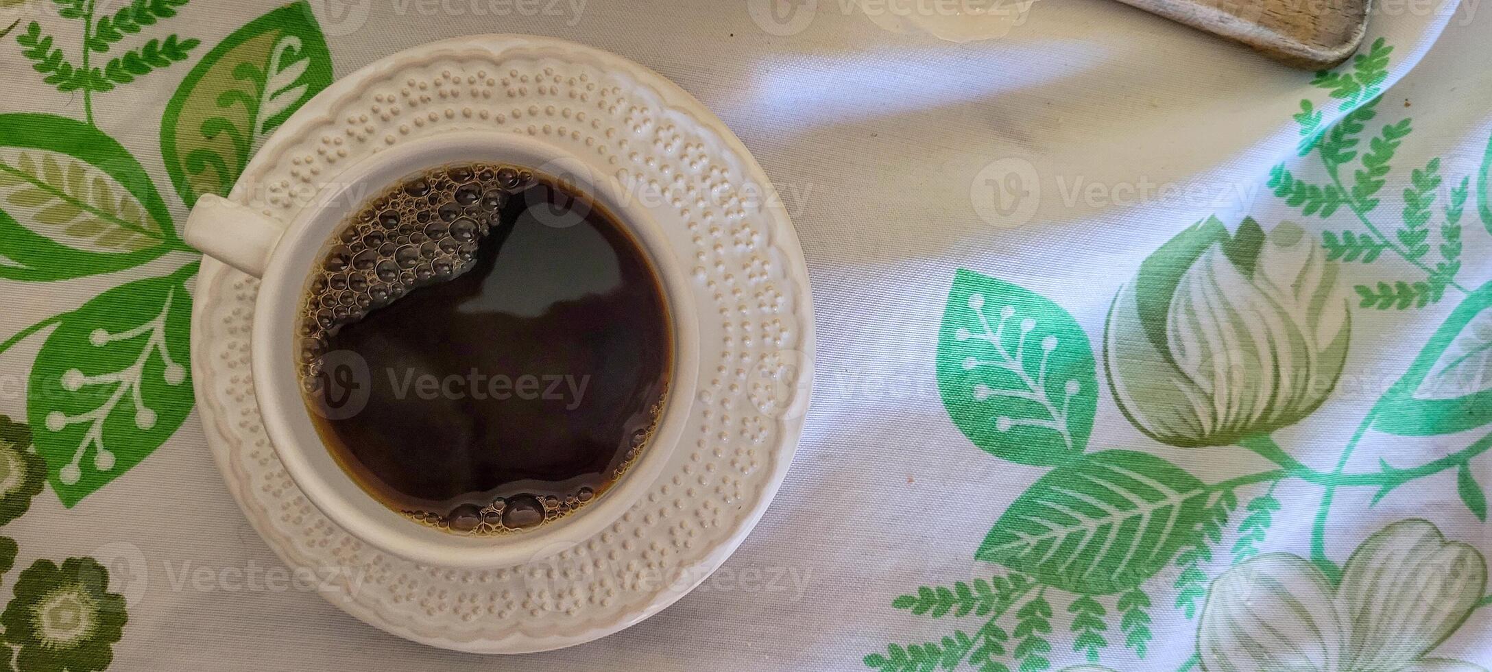 white cup of coffee for breakfast photo