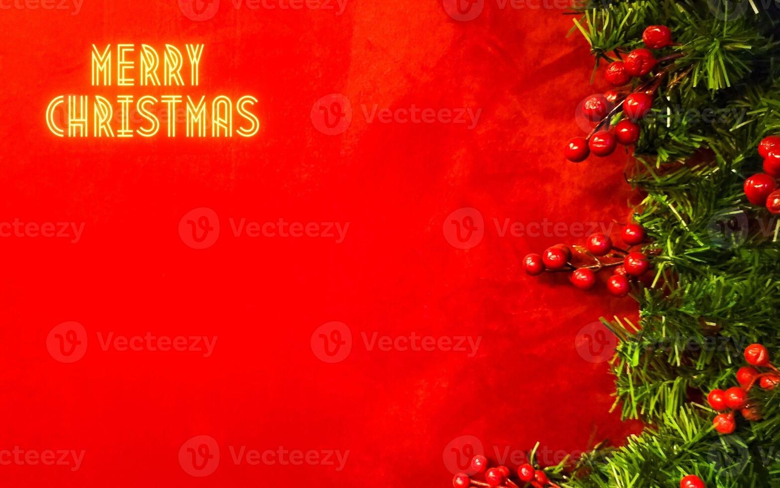 merry christmas with red background with christmas tree, christmas background with writing in gold photo