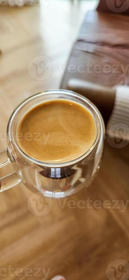 Enjoy the moment with the elegance of this coffee cup in a woman's hands. Warmth and flavor in every detail. Get this irresistible image now photo