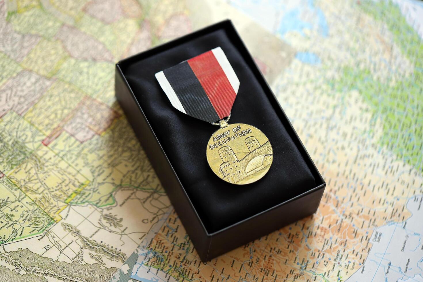 KYIV, UKRAINE - JULY 10, 2024 US Army of Occupation medal. United States military award medal with ribbon and pin. Handmade paper theater props photo