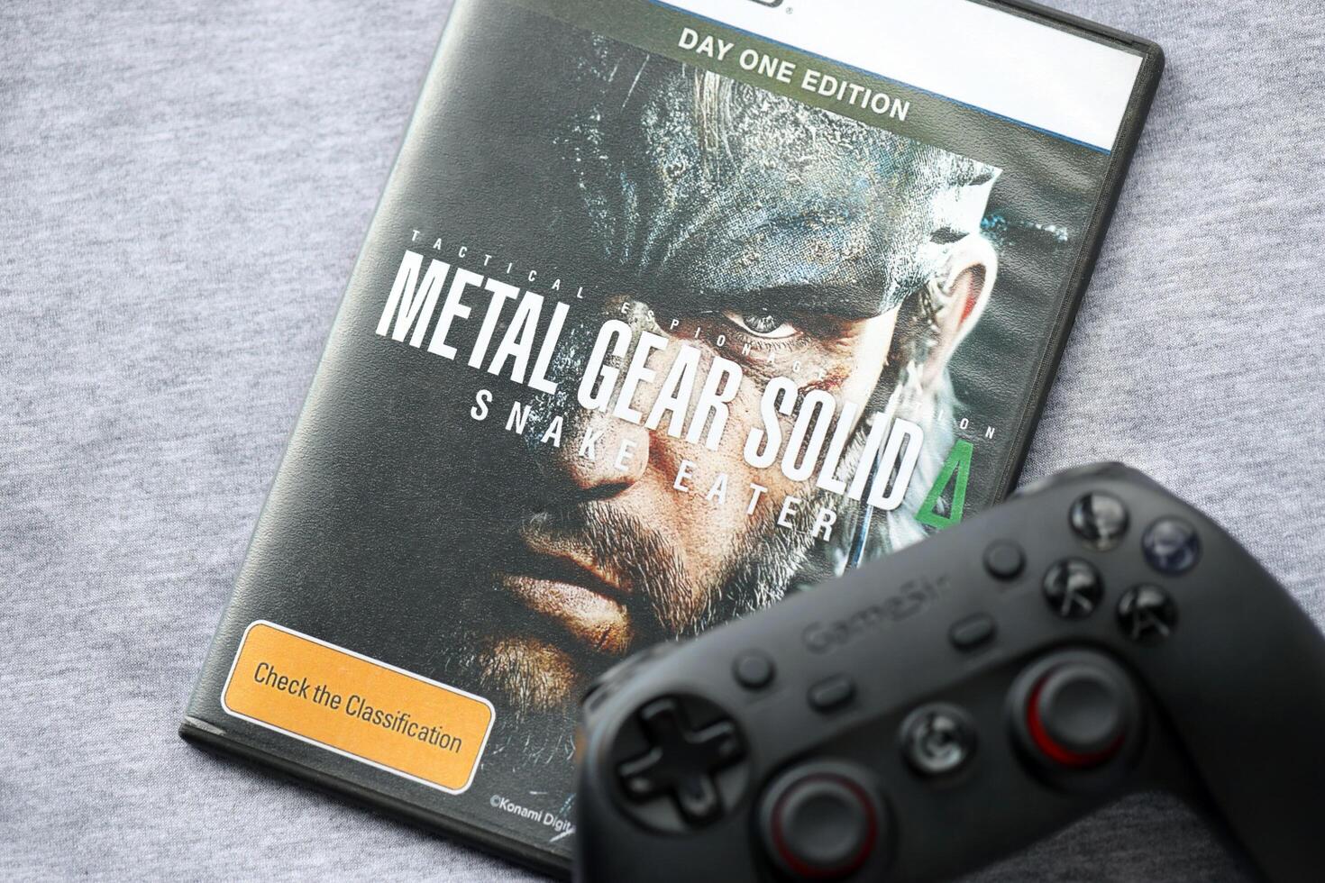 KYIV, UKRAINE - JUNE 26, 2024 Metal Gear Solid Delta Snake Eater PS5 game disc box for console gaming. Popular game disc photo