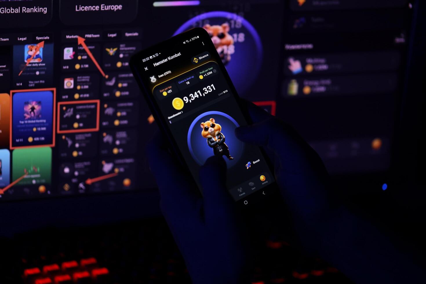 KYIV, UKRAINE - APRIL 20, 2024 Hamster Kombat telegram bot on smartphone screen. Hamster Kombat is a viral Telegram-based crypto game for earn HMSTR tokens by managing virtual crypto exchange photo