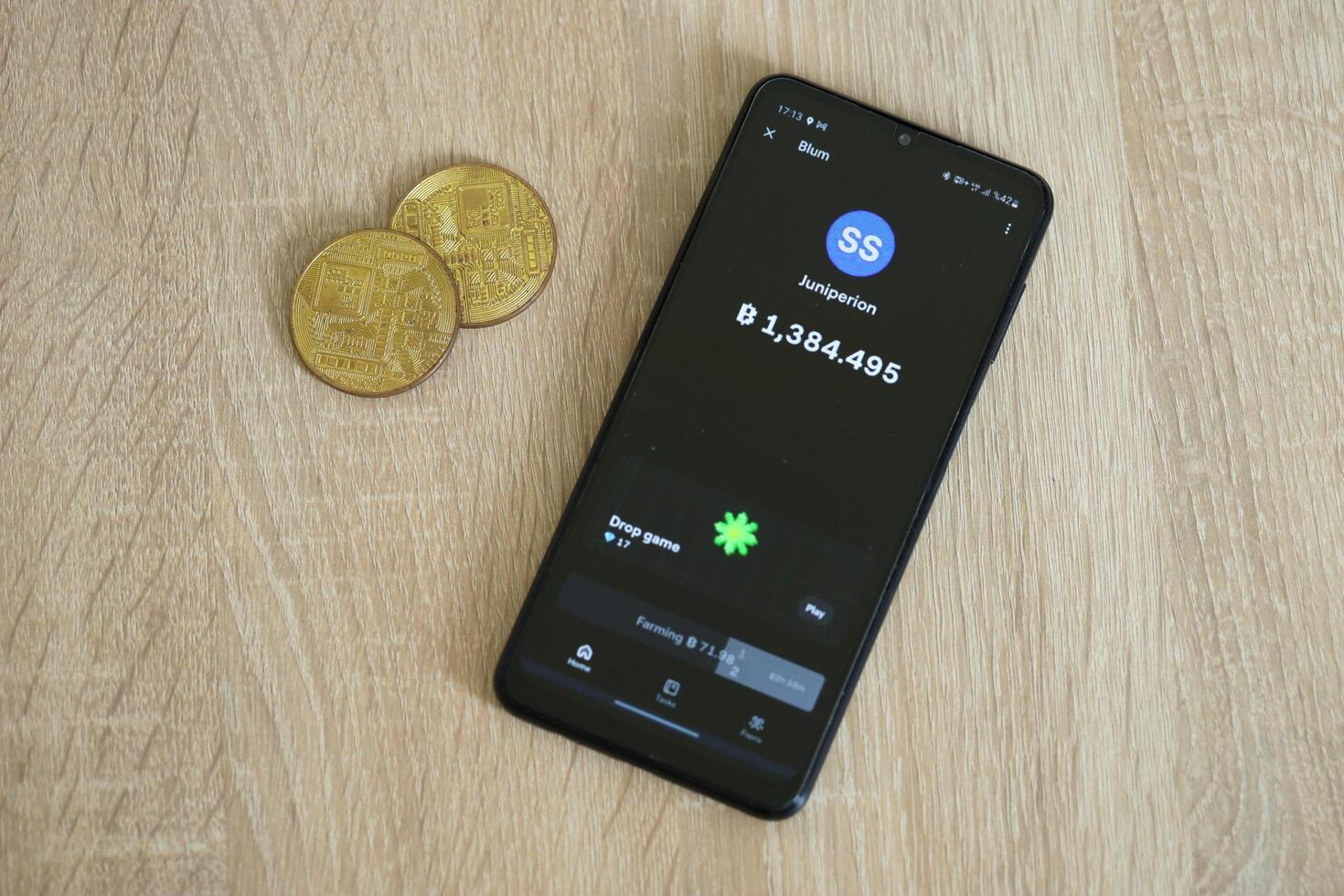 KYIV, UKRAINE - APRIL 20, 2024 Blum telegram bot on smartphone screen. Blum is a viral Telegram based crypto game for earn tokens by managing virtual crypto exchange photo