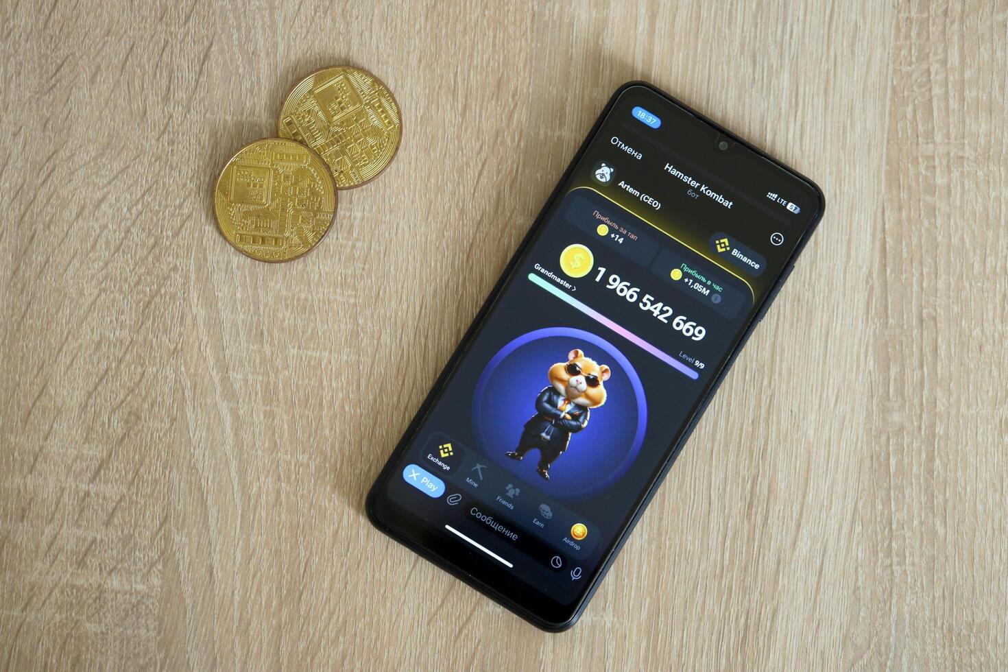 KYIV, UKRAINE - APRIL 20, 2024 Hamster Kombat telegram bot on smartphone screen. Hamster Kombat is a viral Telegram crypto game for earn HMSTR tokens by managing virtual crypto exchange photo