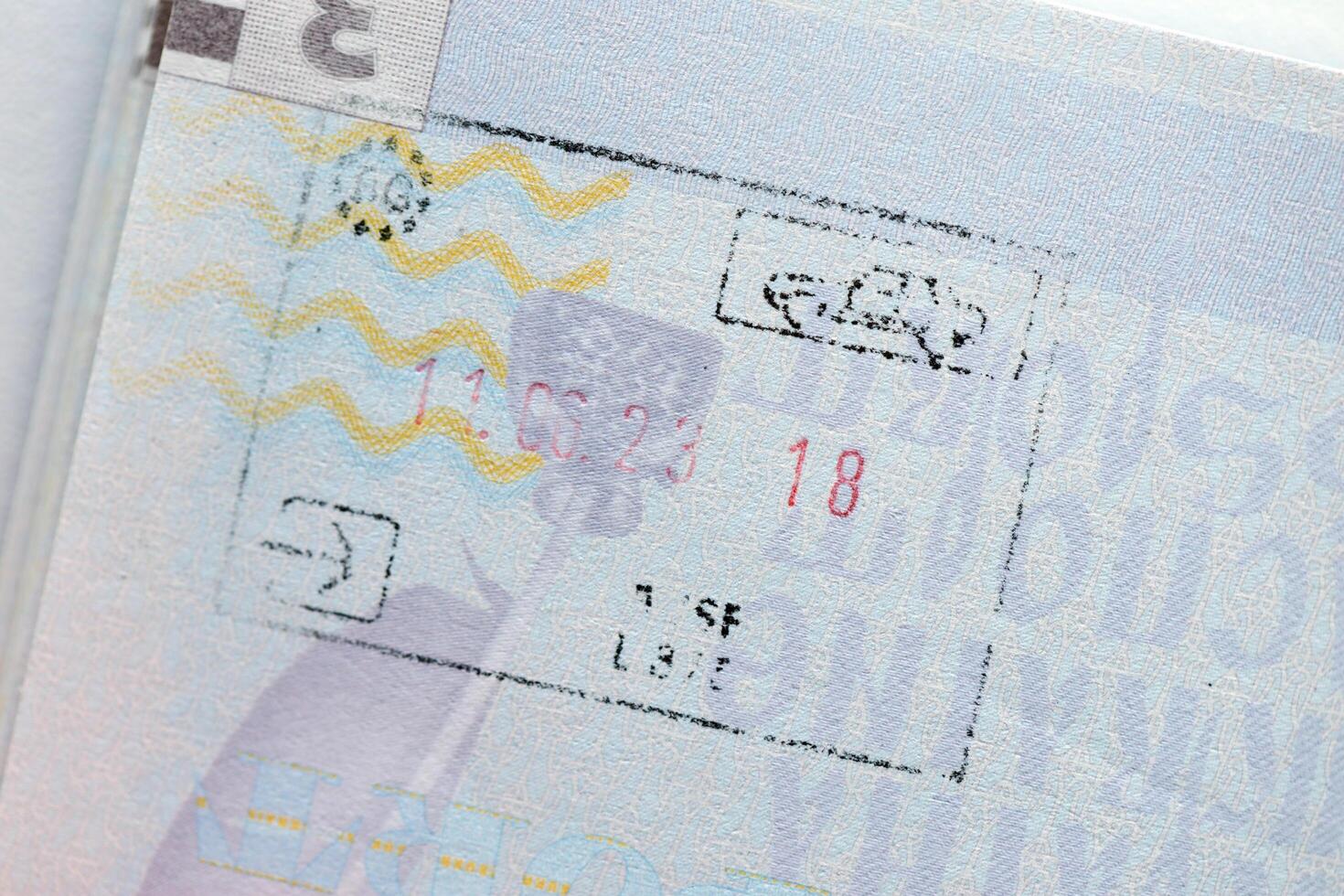 KYIV, UKRAINE - APRIL 20, 2024 Page of foreign passport with visas, Turkiye border stamps, permits to enter countries, concept of traveling around the world, travelers document photo