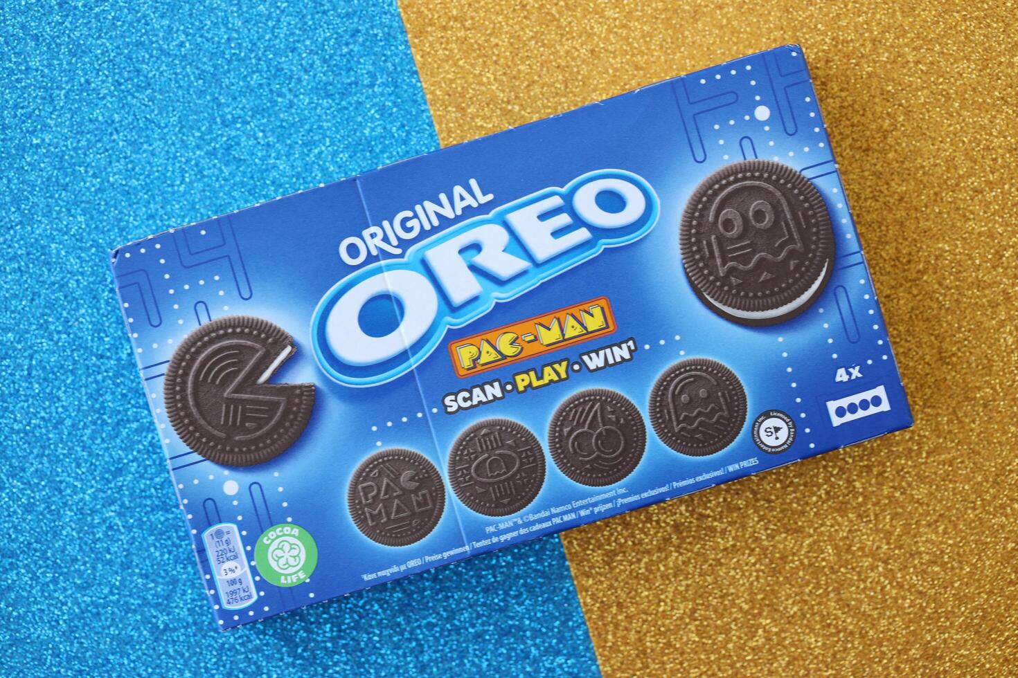 KYIV, UKRAINE - APRIL 20, 2024 Oreo pac-man crispy cookies packs. The brand Oreo owned by american company Mondelez international photo
