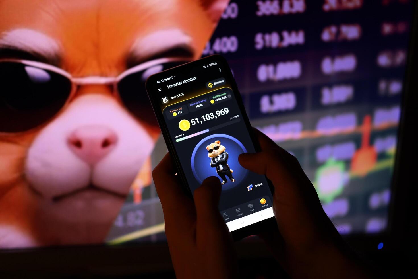 KYIV, UKRAINE - APRIL 20, 2024 Hamster Kombat telegram bot on smartphone screen. Hamster Kombat is a viral Telegram-based crypto game for earn HMSTR tokens by managing virtual crypto exchange photo