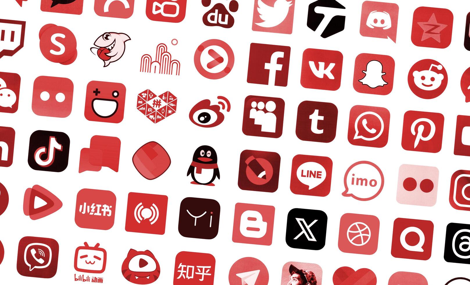 KYIV, UKRAINE - APRIL 1, 2024 Many icons of social media, messengers, sharing platforms photo