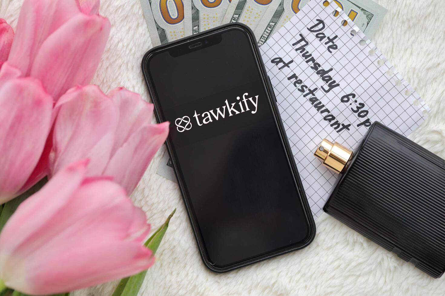 KYIV, UKRAINE - FEBRUARY 23, 2024 Tawkify logo of famous dating website or app on iPhone display photo
