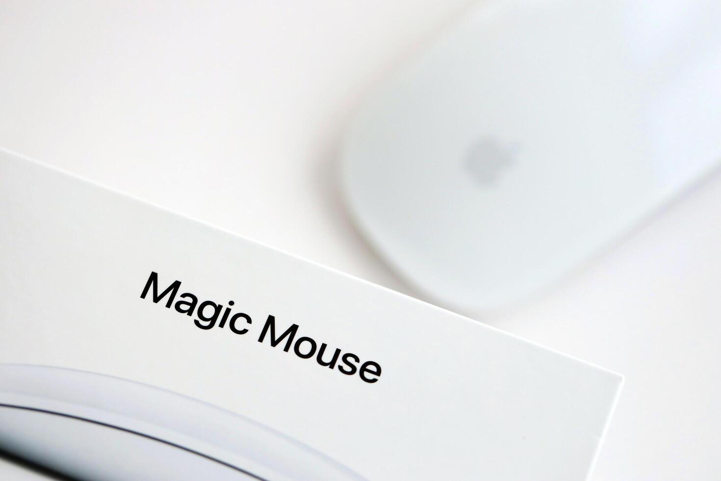 KYIV, UKRAINE - NOVEMBER 27, 2023 Apple Magic Mouse 3rd generation lies on white background photo