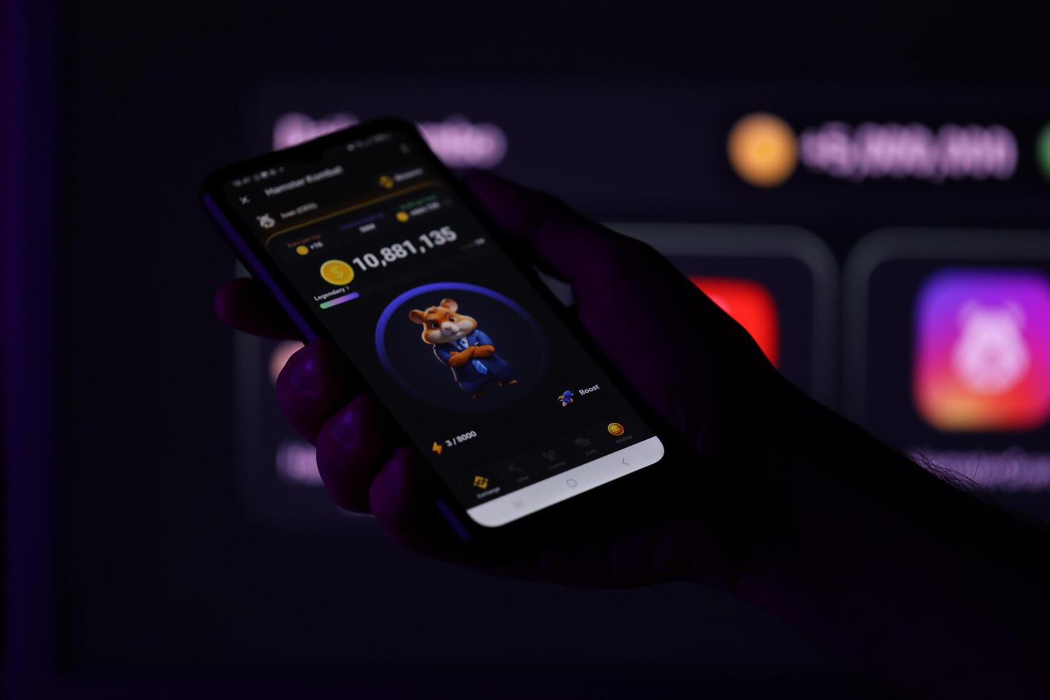 KYIV, UKRAINE - APRIL 20, 2024 Hamster Kombat telegram bot on smartphone screen. Hamster Kombat is a viral Telegram-based crypto game for earn HMSTR tokens by managing virtual crypto exchange photo