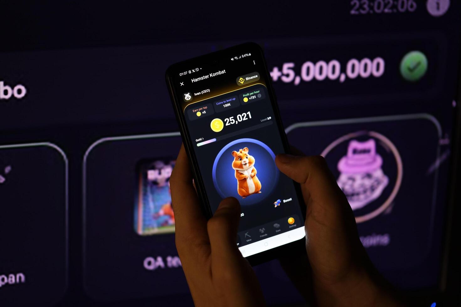 KYIV, UKRAINE - APRIL 20, 2024 Hamster Kombat telegram bot on smartphone screen. Hamster Kombat is a viral Telegram-based crypto game for earn HMSTR tokens by managing virtual crypto exchange photo