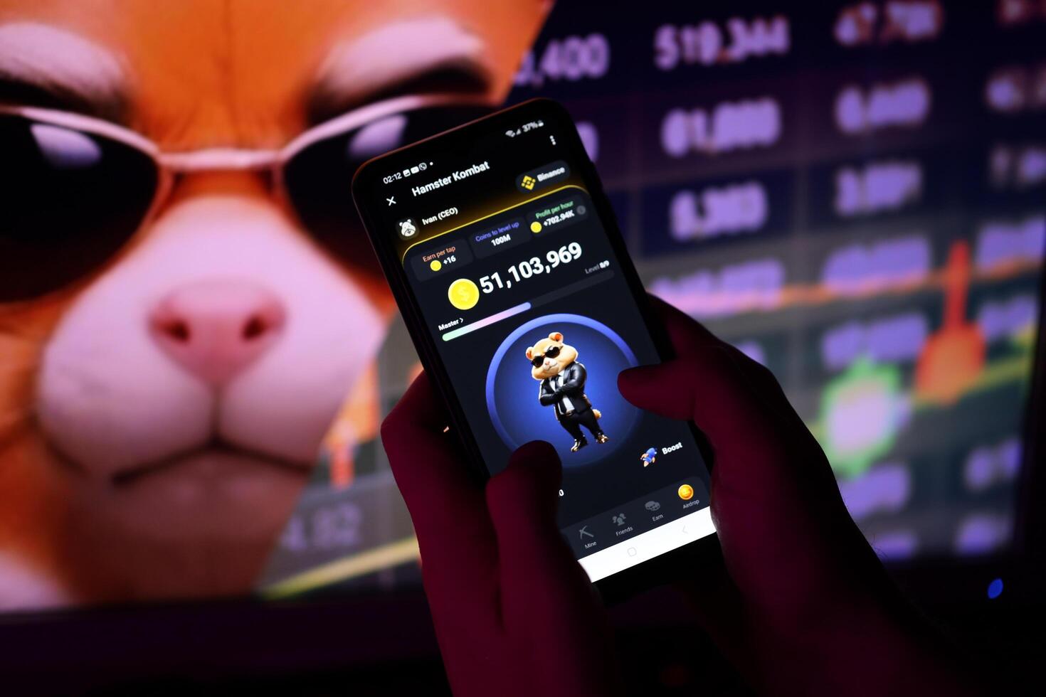 KYIV, UKRAINE - APRIL 20, 2024 Hamster Kombat telegram bot on smartphone screen. Hamster Kombat is a viral Telegram-based crypto game for earn HMSTR tokens by managing virtual crypto exchange photo