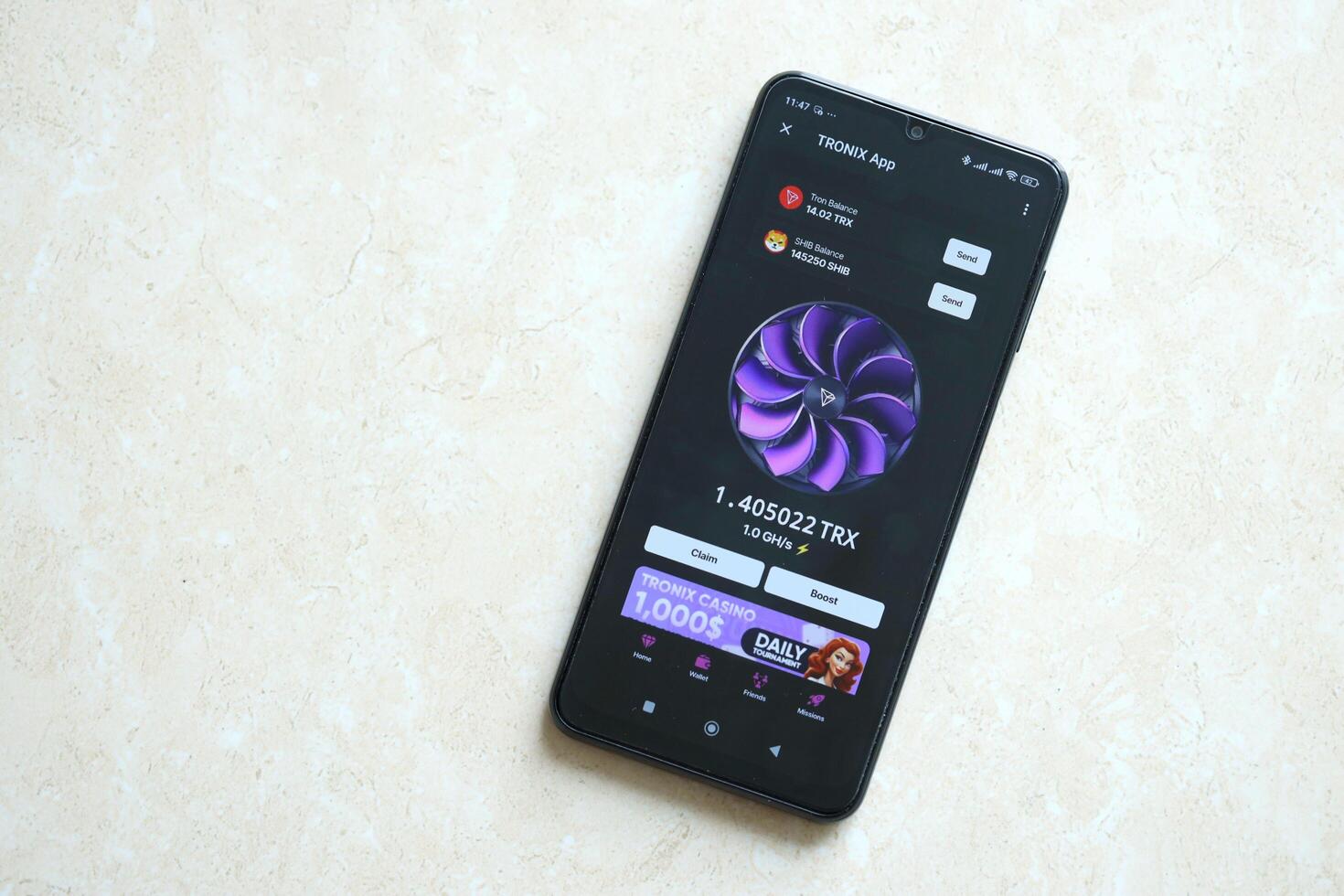 KYIV, UKRAINE - APRIL 20, 2024 Tronix App telegram bot on smartphone screen. Tronix App is a viral Telegram based crypto game for earn TRX tokens by managing virtual crypto exchange photo