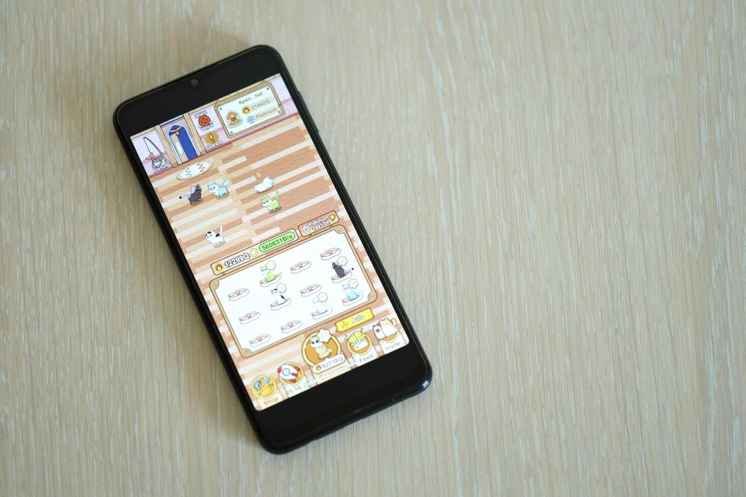 KYIV, UKRAINE - APRIL 20, 2024 Catizen telegram bot on smartphone screen. Catizen is a viral Telegram based crypto game for earn tokens by managing virtual crypto exchange photo