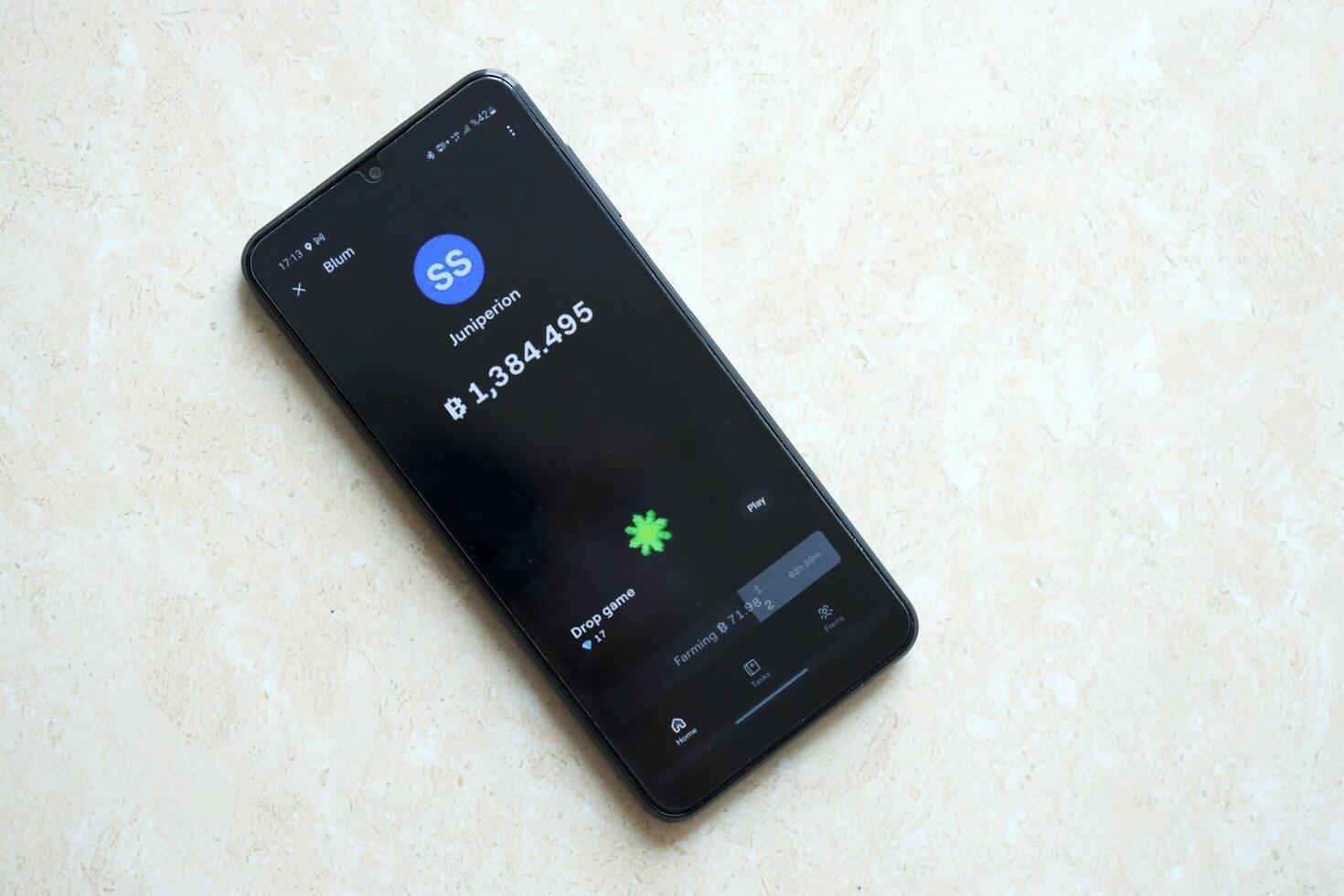 KYIV, UKRAINE - APRIL 20, 2024 Blum telegram bot on smartphone screen. Blum is a viral Telegram based crypto game for earn tokens by managing virtual crypto exchange photo