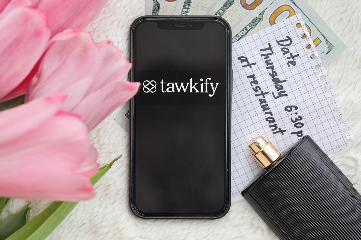 KYIV, UKRAINE - FEBRUARY 23, 2024 Tawkify logo of famous dating website or app on iPhone display photo