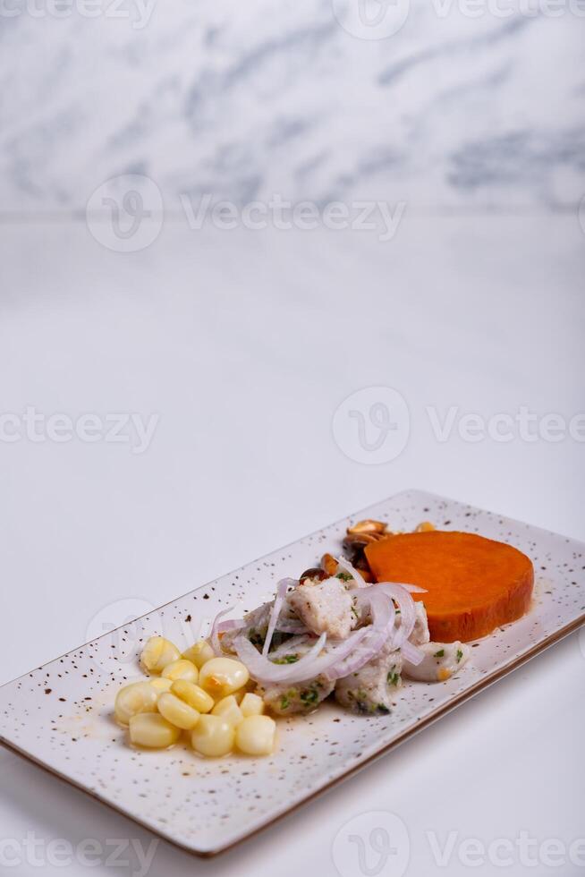 Traditional Peruvian ceviche, a fish-based dish presented in a minimalist way. photo