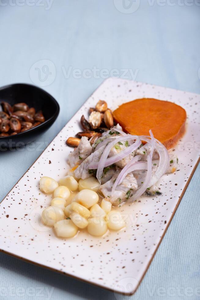 Traditional Peruvian dish called Ceviche presented with a portion of corn. photo