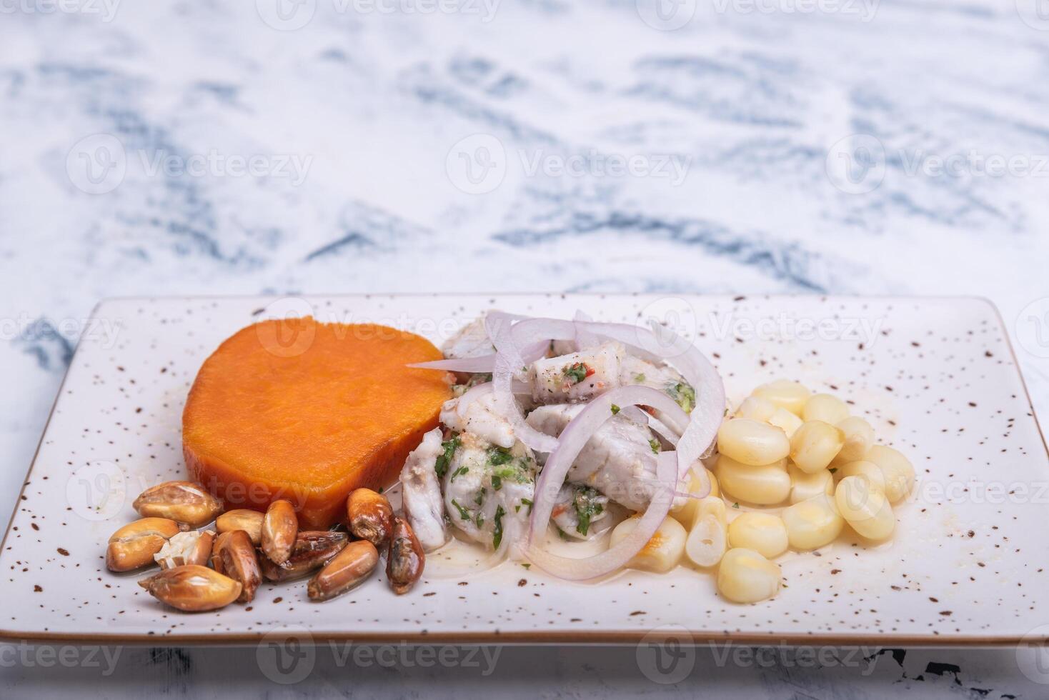 Close-up of traditional Peruvian food called Ceviche presented in a minimalist way on a light background. photo