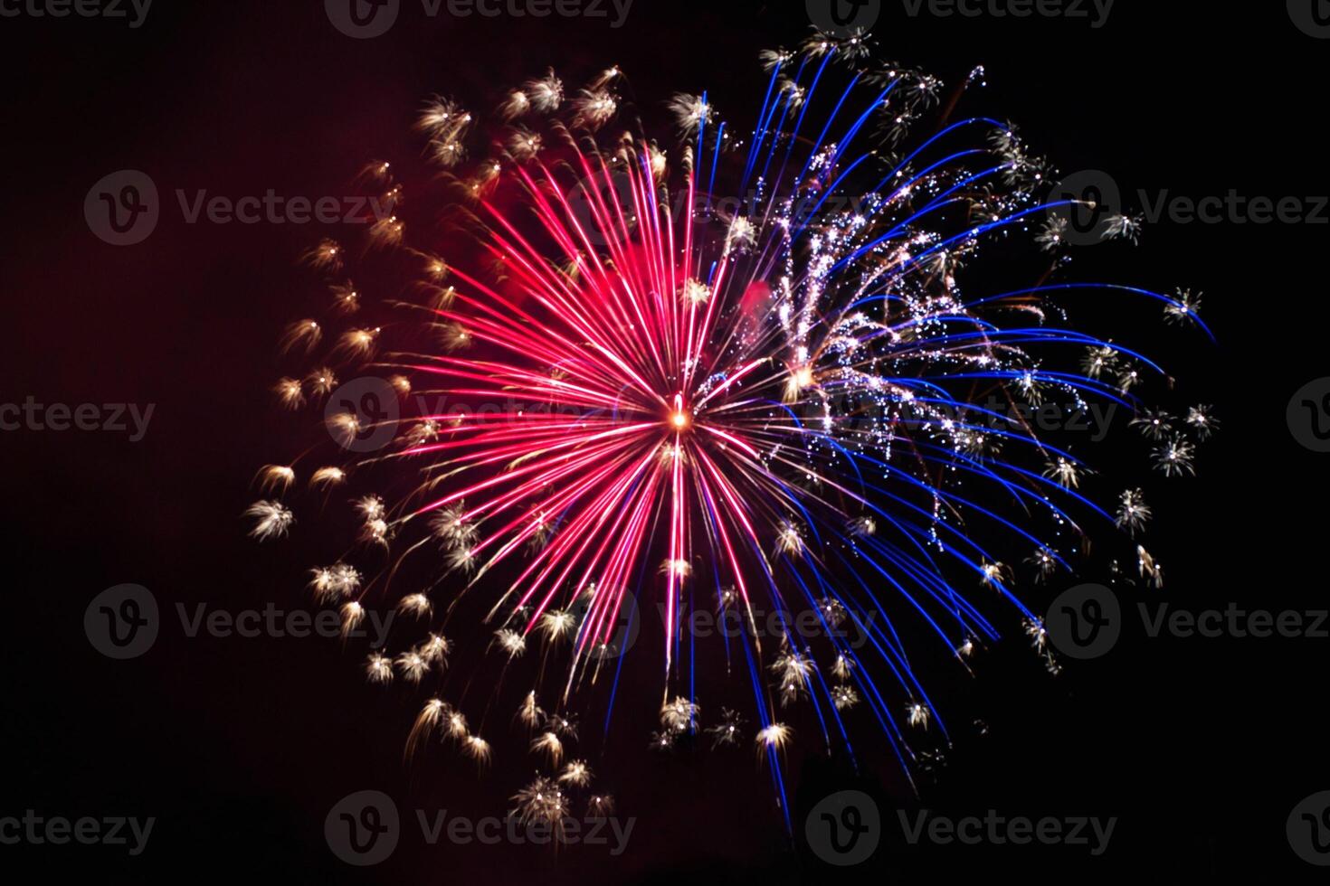 Elegant gold background with bright fireworks in sky photo