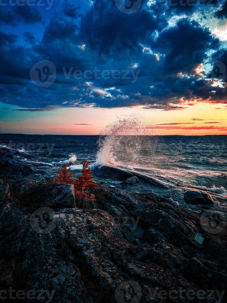 Splashing wave on the lake Melaren in the night. photo
