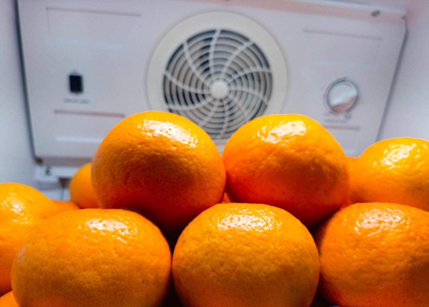 A lot of oranges in supermarket, pile of fresh orange in a supermarket photo