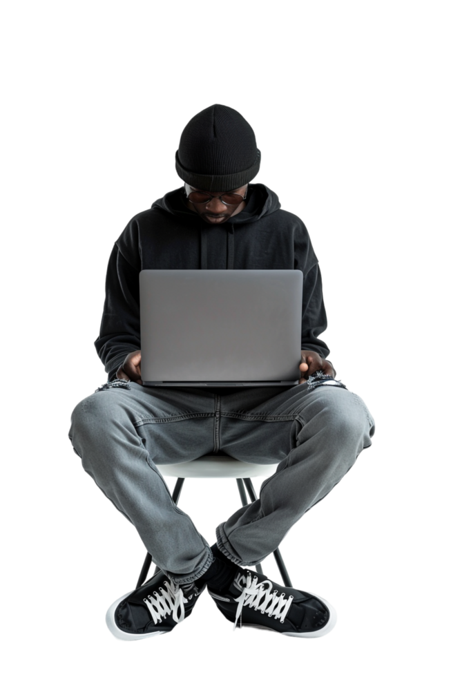 Man with crossed legs using laptop alone against transparent background png