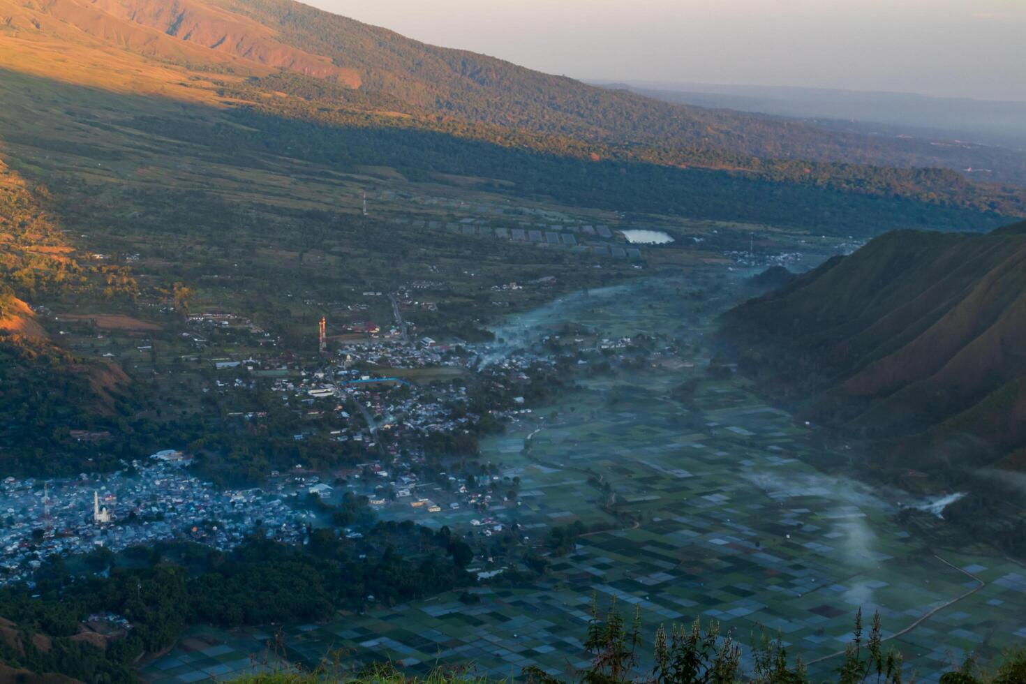View of Sembalun village with a thin mist in the morning photo