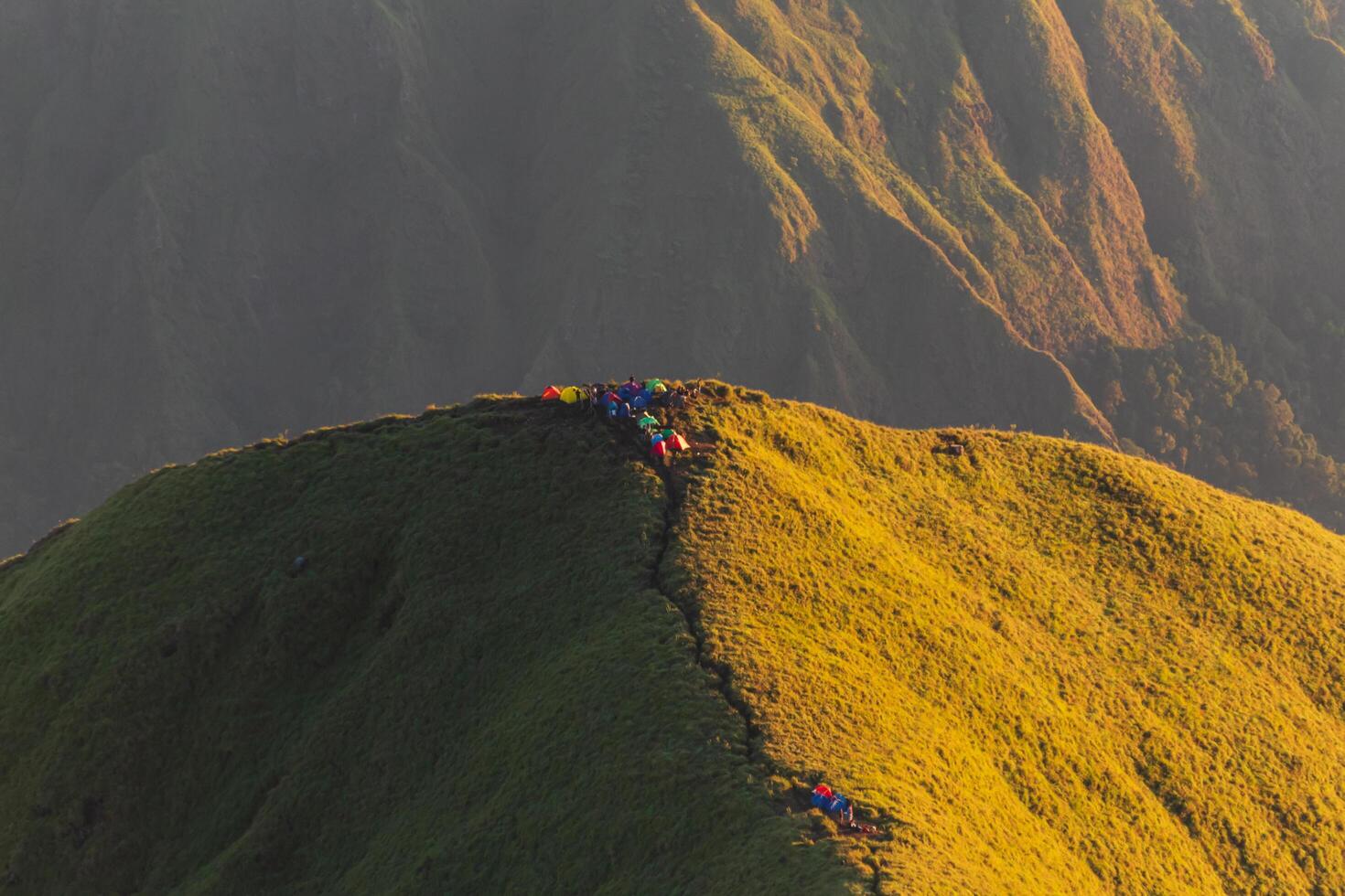 Colorful tents on the top of Mount Anak Dara, Lombok, Indonesia photo