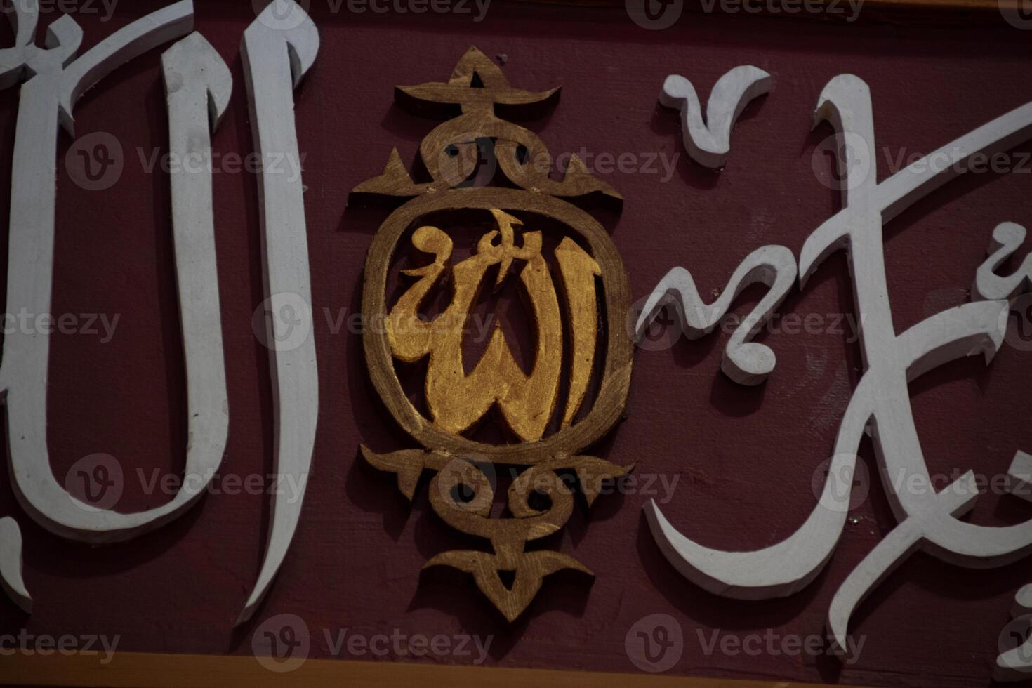 Arabic calligraphy decoration of the names of Allah and Muhammad in Islamic architectural decoration photo