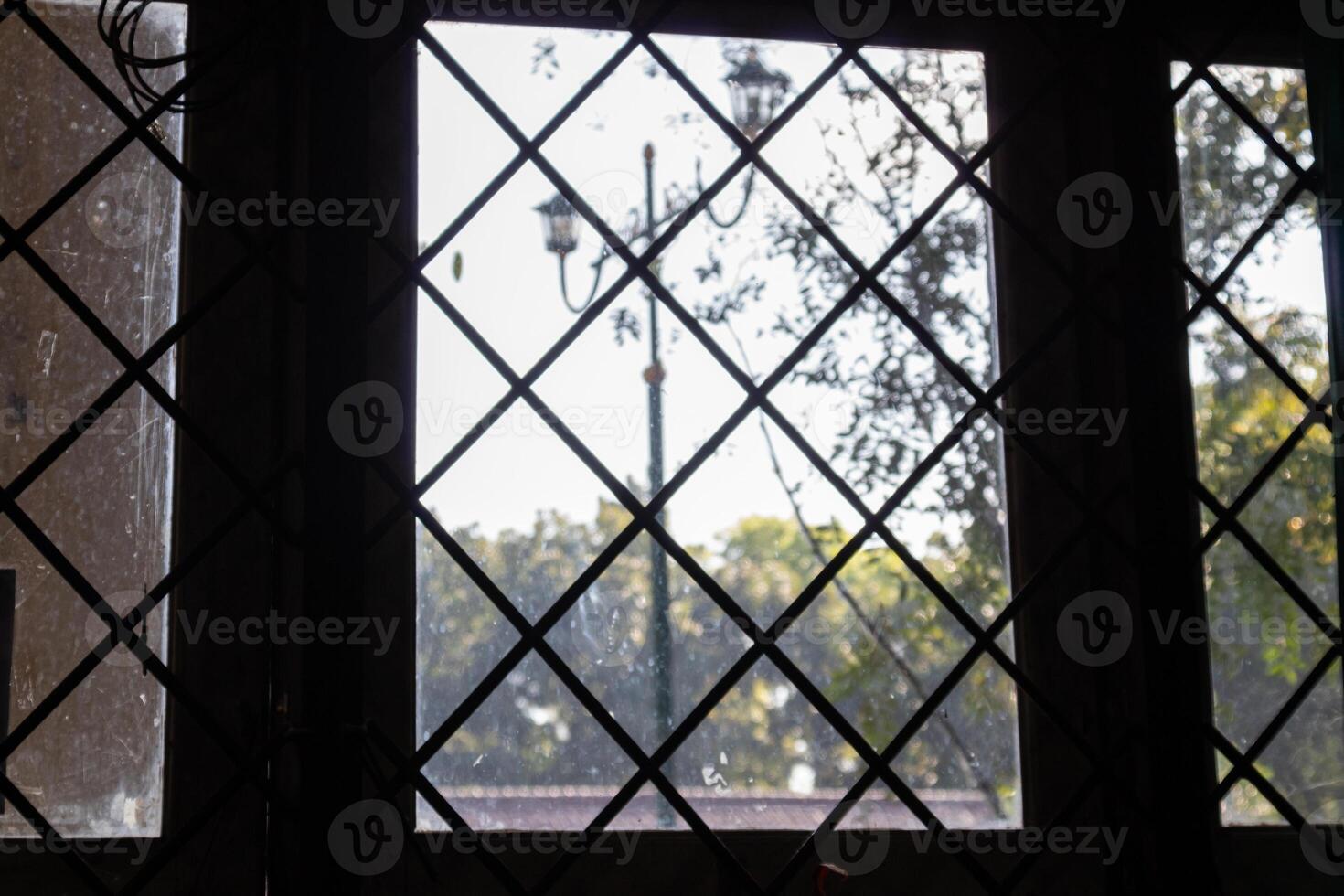 View From Window with backlit iron blinds photo