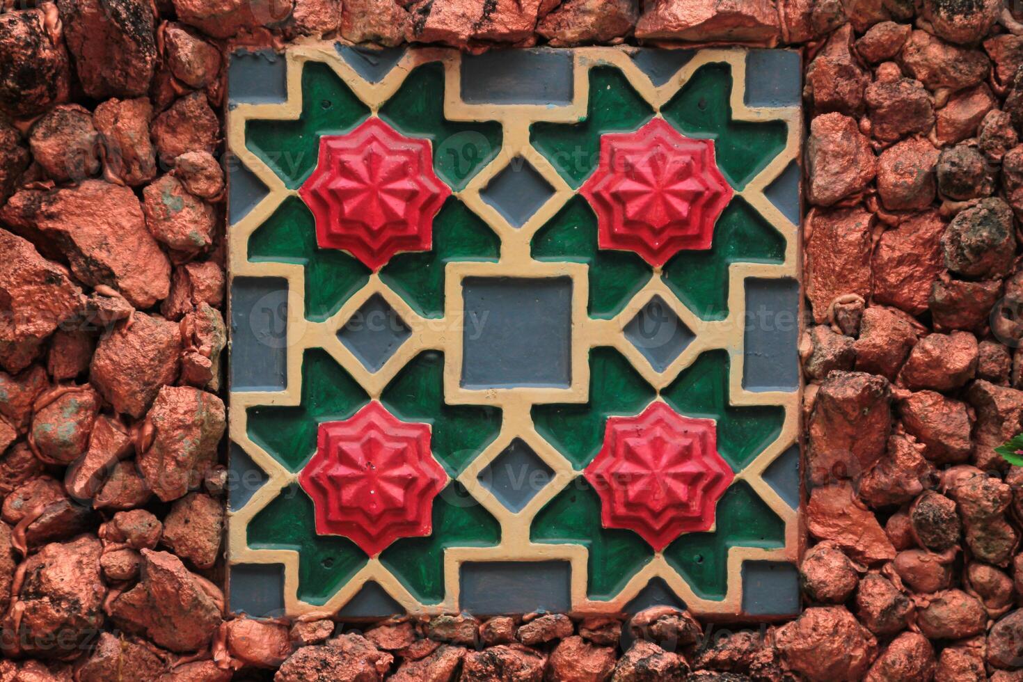 Colorful Clay tile art with stone wall background photo