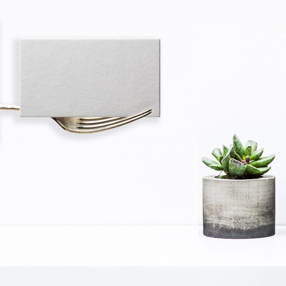 Fork Holding a Blank Card Mockup photo