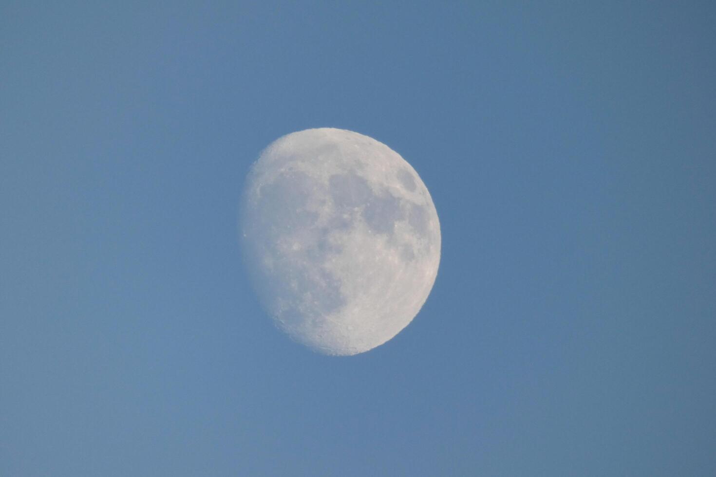 Moon seen during the day in crescent photo
