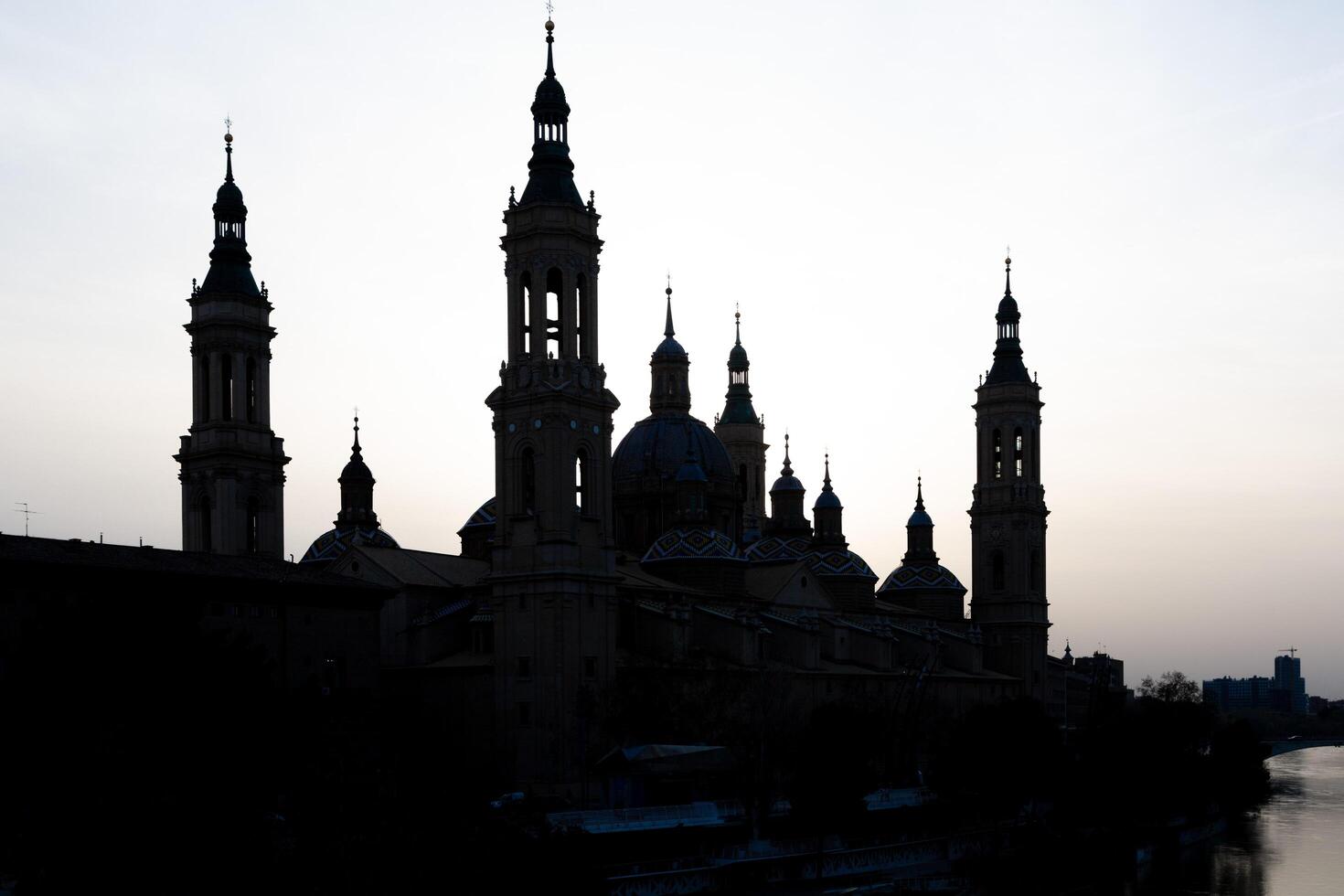 Sunset silhouette of basilica del pilar, zaragoza photo
