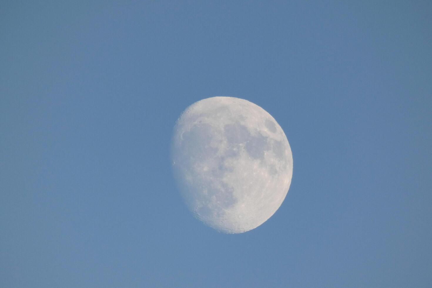 Moon seen during the day in crescent photo