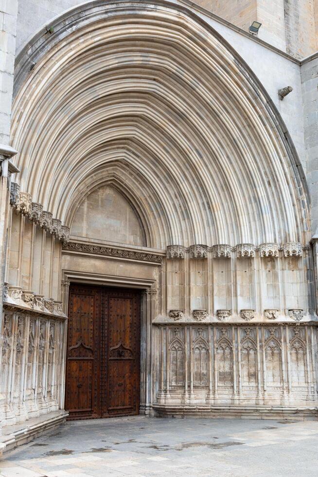 Architectural detail of an arched stone doorway showing concentric rings photo