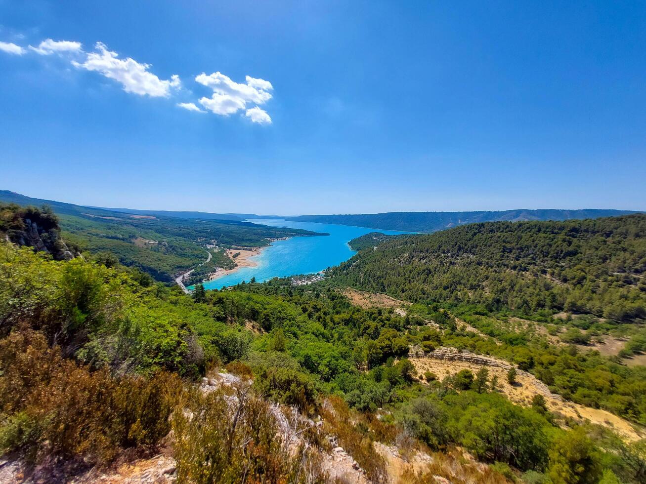 magnificent lake of Sainte-Croix with clear crystalline waters, incredible view of blue waters where you can sunbathe, do sports such as canoeing, lake surrounded by nature, trees, rocks. Sunny day photo
