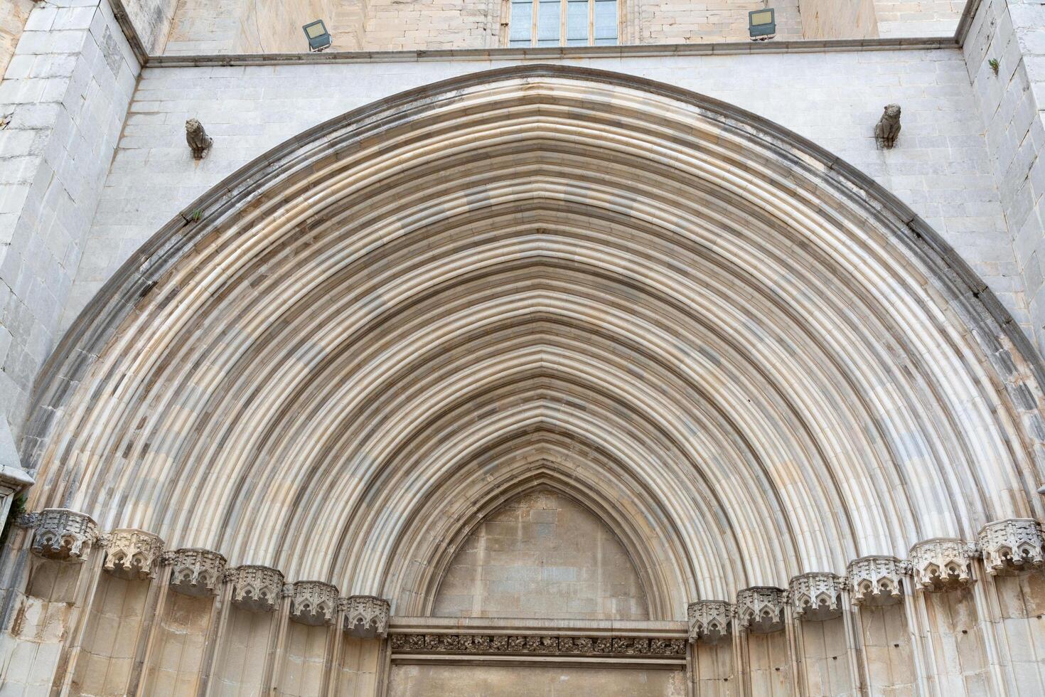 Architectural detail of an arched stone doorway showing concentric rings photo